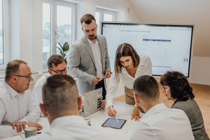 Team collaborating around a table in a modern office