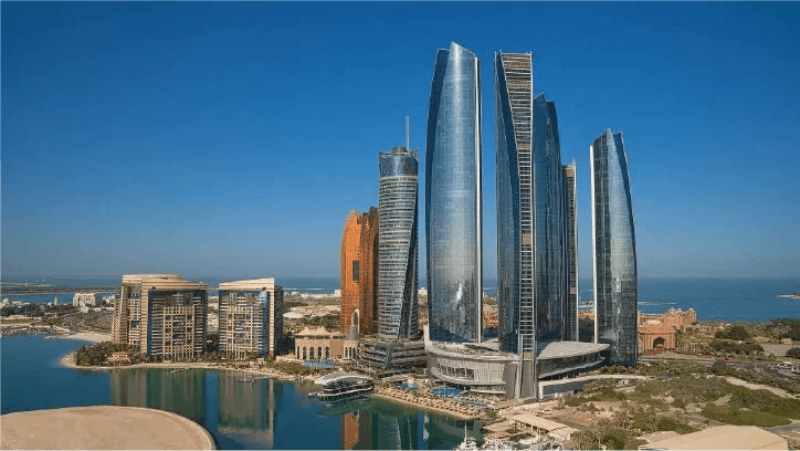 Etihad Towers skyline from the water on a clear day